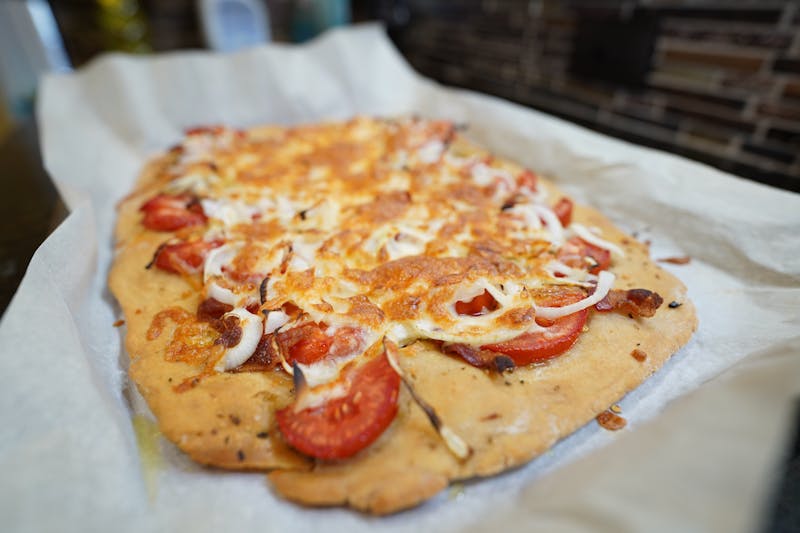 Goat cheese and caramelised onion vegetarian pizza