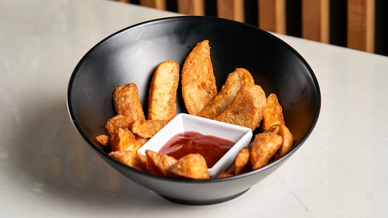 Loaded potato wedges with sour cream and chives