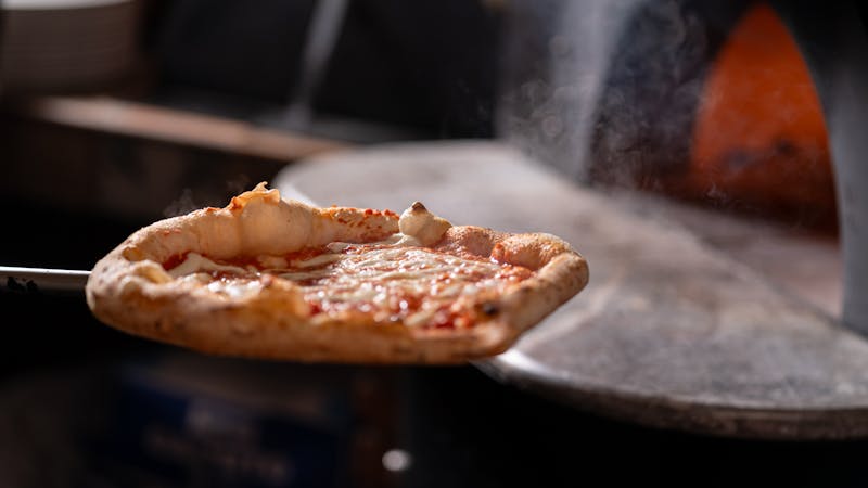 Four cheese pizza with mozzarella, gorgonzola, parmesan